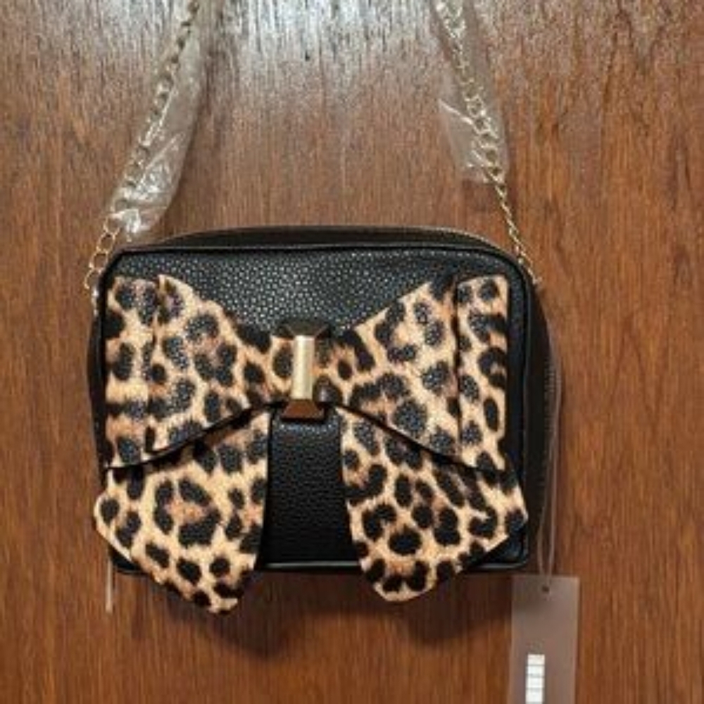 LIKE DREAMS" purse, specifically identified as the Leopard Cross Body Bow.